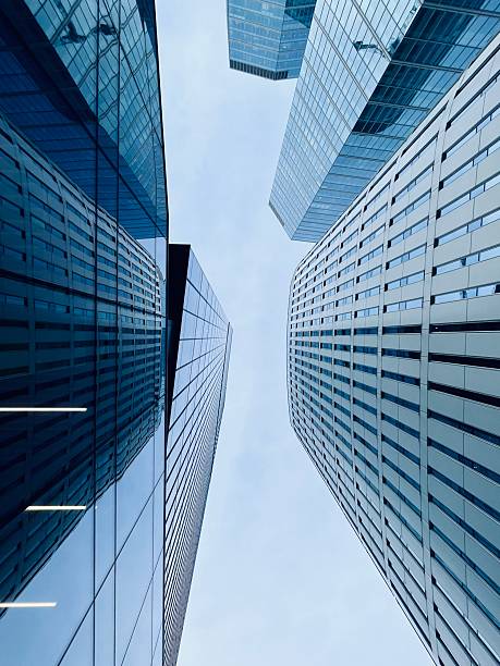 istock Low angle view of modern office windows skyscraper in urban abstract, geometric and minimalist stylistics 2219333797