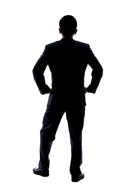 istock Businessman with arms akimbo on white background 2219335263