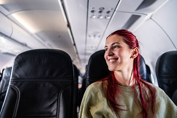 istock Young woman contemplating on a plane 2219335316