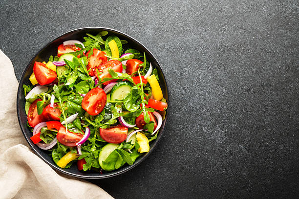 istock Fresh salad with leaves and vegetables. 2219335484
