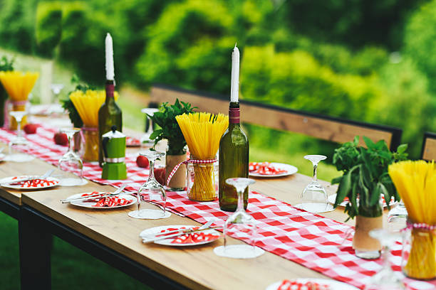 Elegant Table Setting With Wine Bottles Used Creatively as Candle Holders