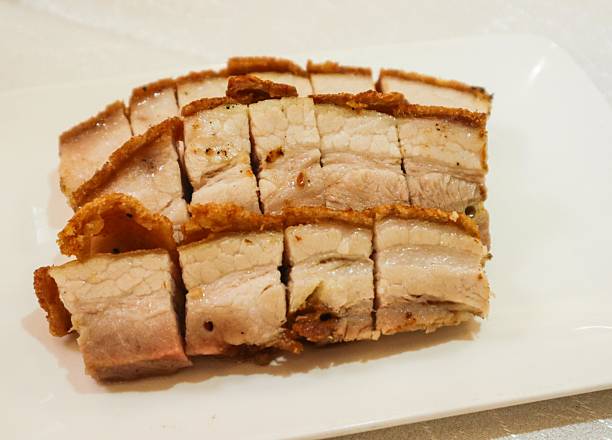 crispy roasted pork belly in three layers cut into pieces