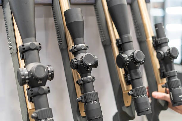 istock Hunting rifle scopes on display at a show 2219338207