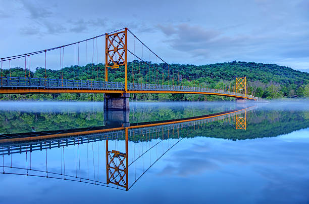 Beaver Bridge, also known as the Little Golden Gate Bridge, spans 554 feet across the White River. The bridge is located northwest of Eureka Springs in the Ozark Mountains of Arkansas