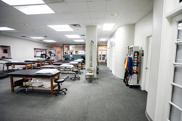 istock Empty Therapy Clinic Waiting Room with Examination Tables 2219342152