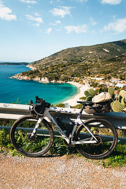 istock Bicycle parked above calm bay and beach 2219344773