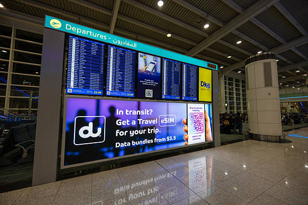 Dubai, United Arab Emirates - April 6, 2025 : Flight information board at the Dubai International Airport.