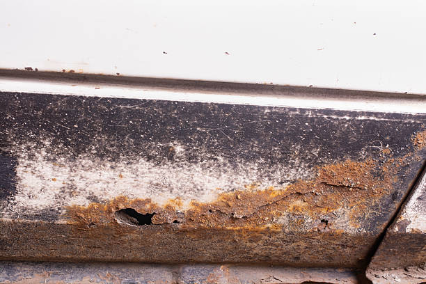istock Rust and corrosion hole on an old car. 2219346257