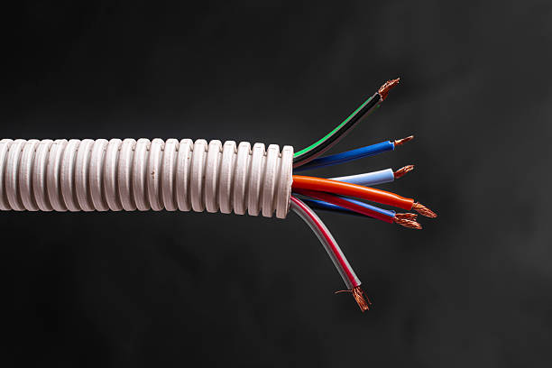 istock A bundle of electrical wires in a plastic corrugated tube. 2219346267