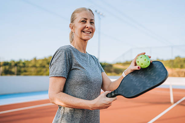 istock Mature woman plays pickleball 2219346763