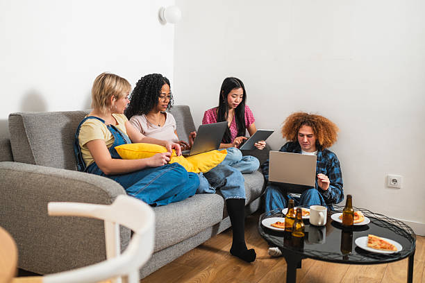 istock Young multiethnic friends working and relaxing together at home 2219350108