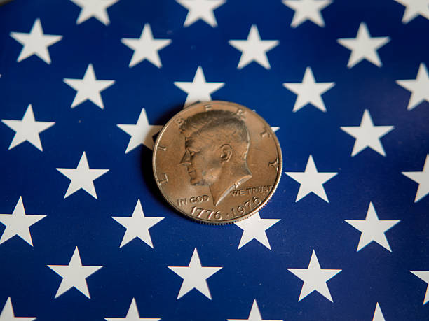 Kennedy Half Dollar Coin on American Flag Background