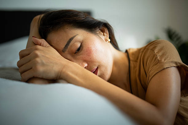 istock Asian woman struggles with mental breakdown alone at home. 2219358435