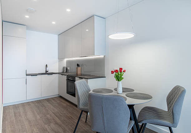 istock Modern Minimalistic Kitchen With Dining Table and Elegant Grey Chairs 2219358860
