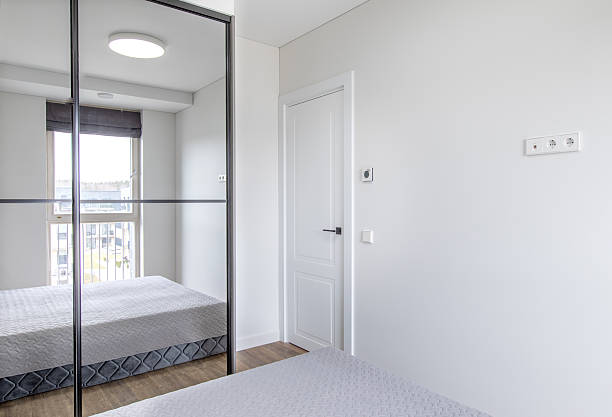 istock Modern Home Bedroom with Simple Design and Large Mirrored Closet 2219358981