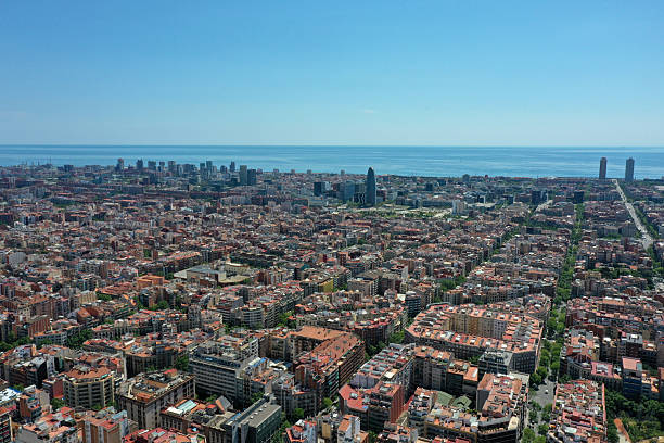 Barcelona City panoramic view with the mediterranean sea. The image shows the wonderful capital of  of Catalonia, captured on a sunny day during spring season.