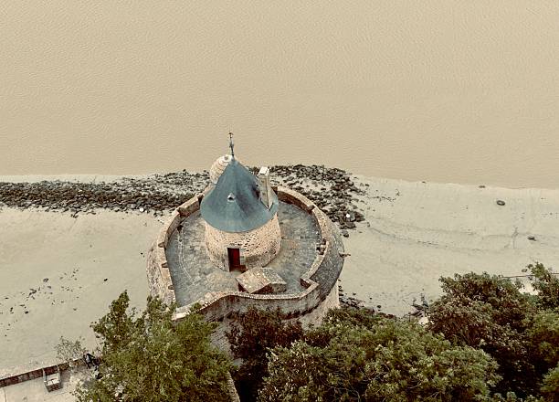 10th. Century Benedictine monks established ramparts and fortifications and soon became a major pilgrimage destination on an island in Normandy, France.