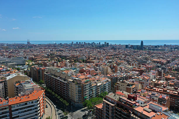 Barcelona City panoramic view with the mediterranean sea. The image shows the wonderful capital of  of Catalonia, captured on a sunny day during spring season.
