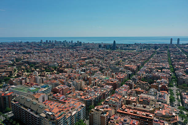 Barcelona City panoramic view with the mediterranean sea. The image shows the wonderful capital of  of Catalonia, captured on a sunny day during spring season.