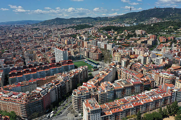 Barcelona City panoramic view. The image shows the wonderful capital of  of Catalonia with residential buildings, captured on a sunny day during spring season.