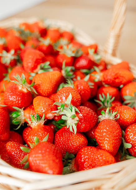 istock Fresh Strawberries in Wicker Basket Display 2219372313
