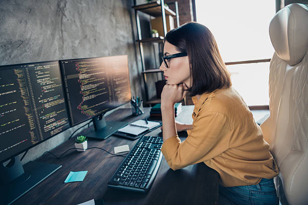 istock Profile side view portrait of attractive clever focused girl cyber engineer analyzing html process service at workplace workstation indoors 2219373372