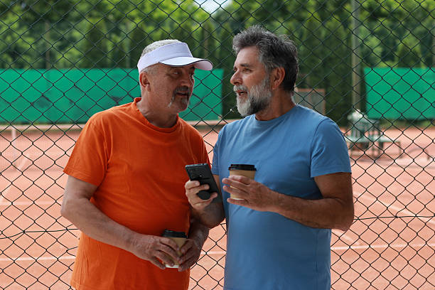 istock Two senior men enjoy in coffee and talking before training 2219378176