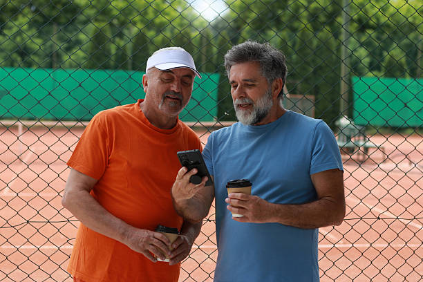 istock Two senior men enjoy in coffee and talking before training 2219378202