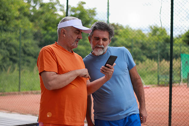 istock Two senior men enjoy in coffee and talking before training 2219378266