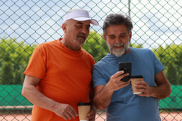 istock Two senior men enjoy in coffee and talking before training 2219378370