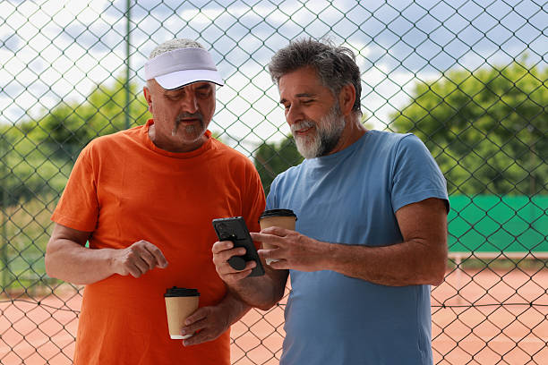 istock Two senior men enjoy in coffee and talking before training 2219378458
