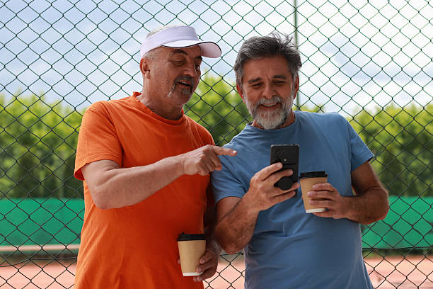istock Two senior men enjoy in coffee and talking before training 2219378459