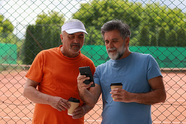 istock Two senior men enjoy in coffee and talking before training 2219378549