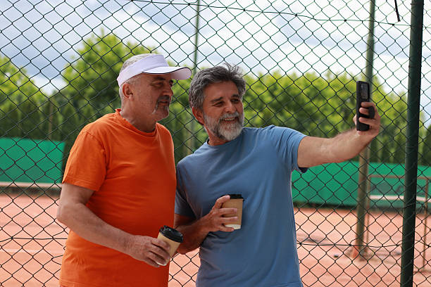 istock Two senior men enjoy in coffee and talking before training 2219379296