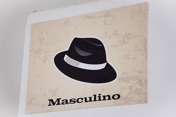 Sign on the wall indicating the men's bathroom in the salon