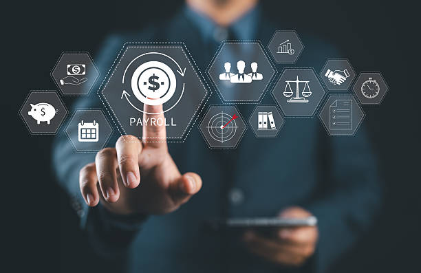 istock Payroll Management and Financial Processing System. Businessman works on payroll management with icons for payment, efficient payroll operations and employee salaries, scheduling, analysis finance. 2219385887