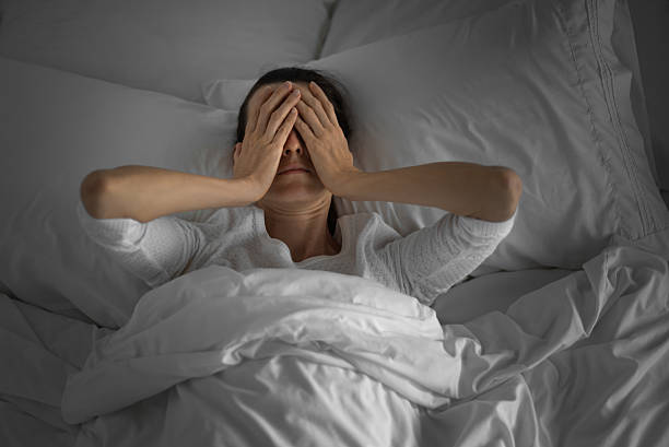 istock Young woman feeling tired, suffering from insomnia bad sleep. 2219389444