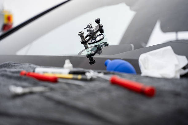 istock Mounted windshield repair bridge holds resin applicators securely over the crack. Bridge tool for injecting resin in damaged windshield. Accurate application improves durability and appearance. 2219389830