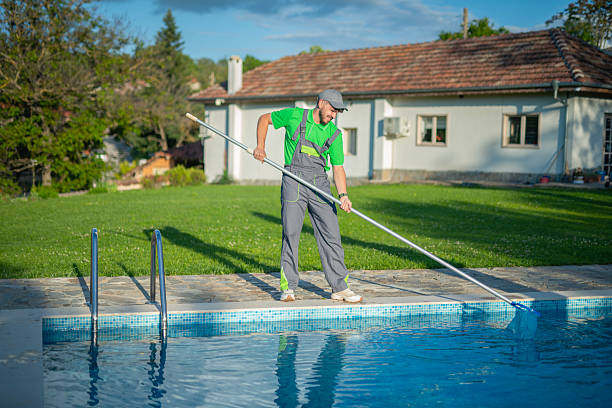 istock Swimming pools maintainer cleaning out one at a private home. 2219391392