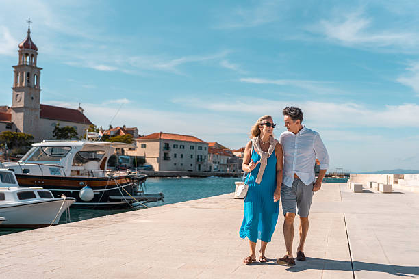 istock Mature Couple Strolling Adriatic Coastal Town 2219392594