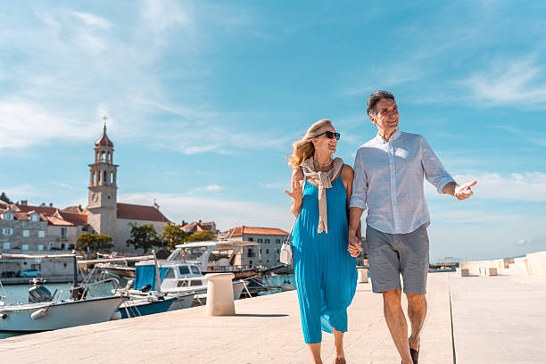 istock Mature Couple Strolling Adriatic Coastal Town 2219392598
