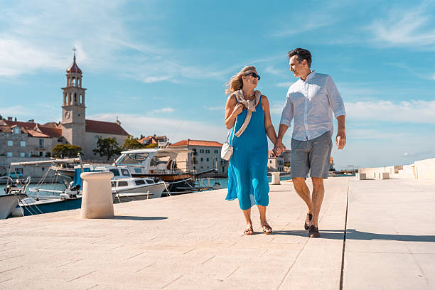 istock Mature Caucasian Couple Strolling Adriatic Coast 2219392600