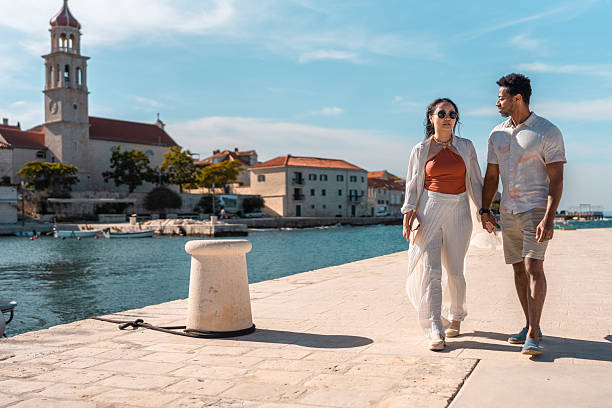 istock Diverse Couple Enjoying Coastal Walk in Sutivan 2219392621
