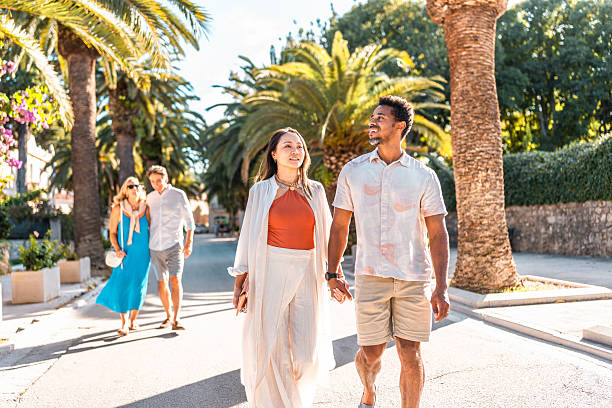 istock Diverse Couples Walking in Coastal Sutivan 2219392650