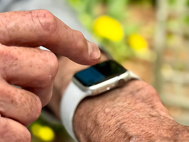 istock EXCU older man touches screen of smart watch 2219393312
