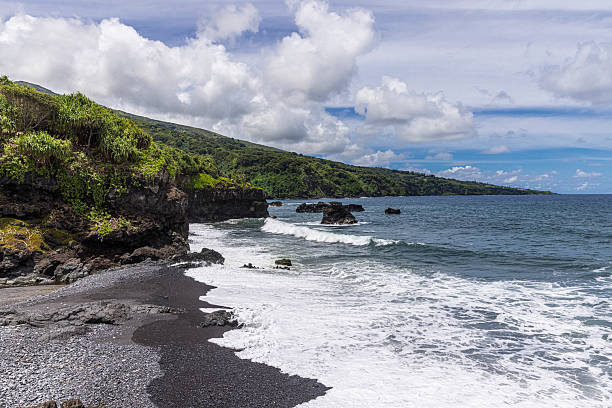Scenic black sand beach near Hana, Maui.