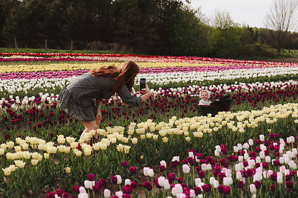 istock Mother and Daughter in Tulip Field 2219396732
