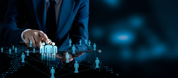 istock Businessman touching virtual interface selecting human resource for recruitment or HR management, futuristic digital network of people for corporate team connection and employment strategy 2219397355