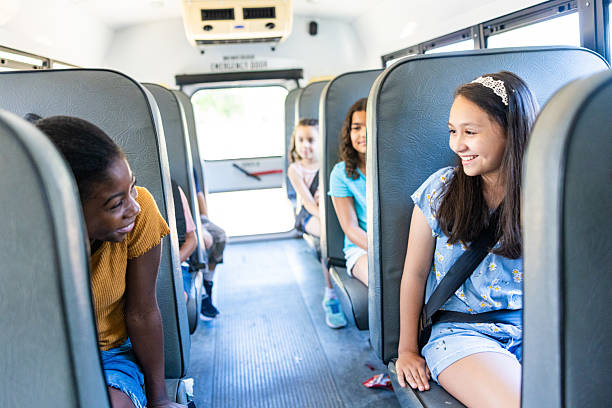 istock Diverse children sitting on the school bus seats 2219397363