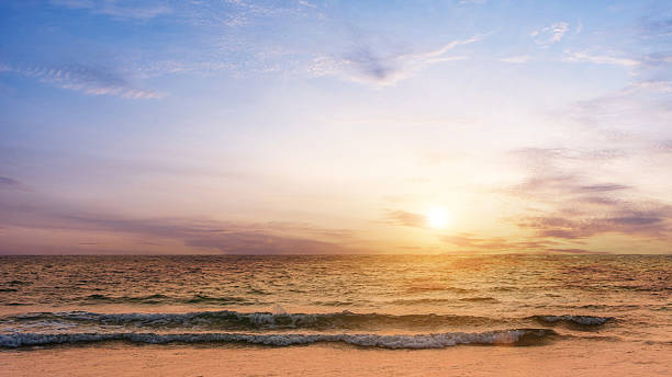 istock Beautiful sunset sky over on the sea background. 2219402431